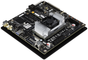 Photo of the Jetson TX1 Developer Kit, including module, reference carrier and camera board.